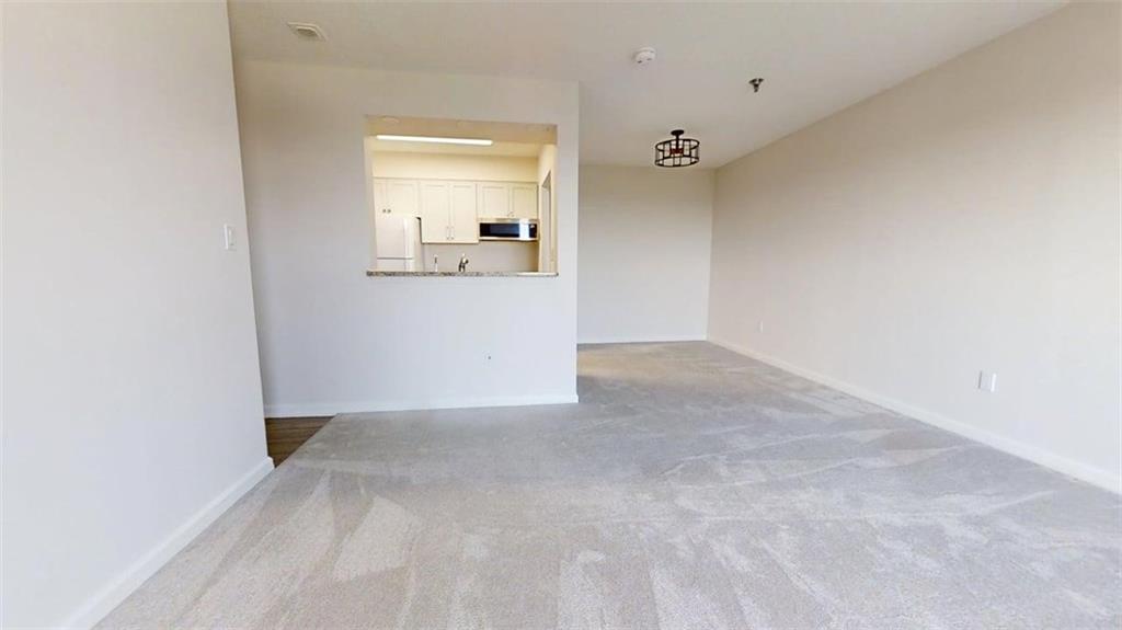 300 Johnson Ferry Road, Unit B805 Sandy Springs, GA 30328 - Photo 8 of 31 an empty room with a bathroom and mirror
