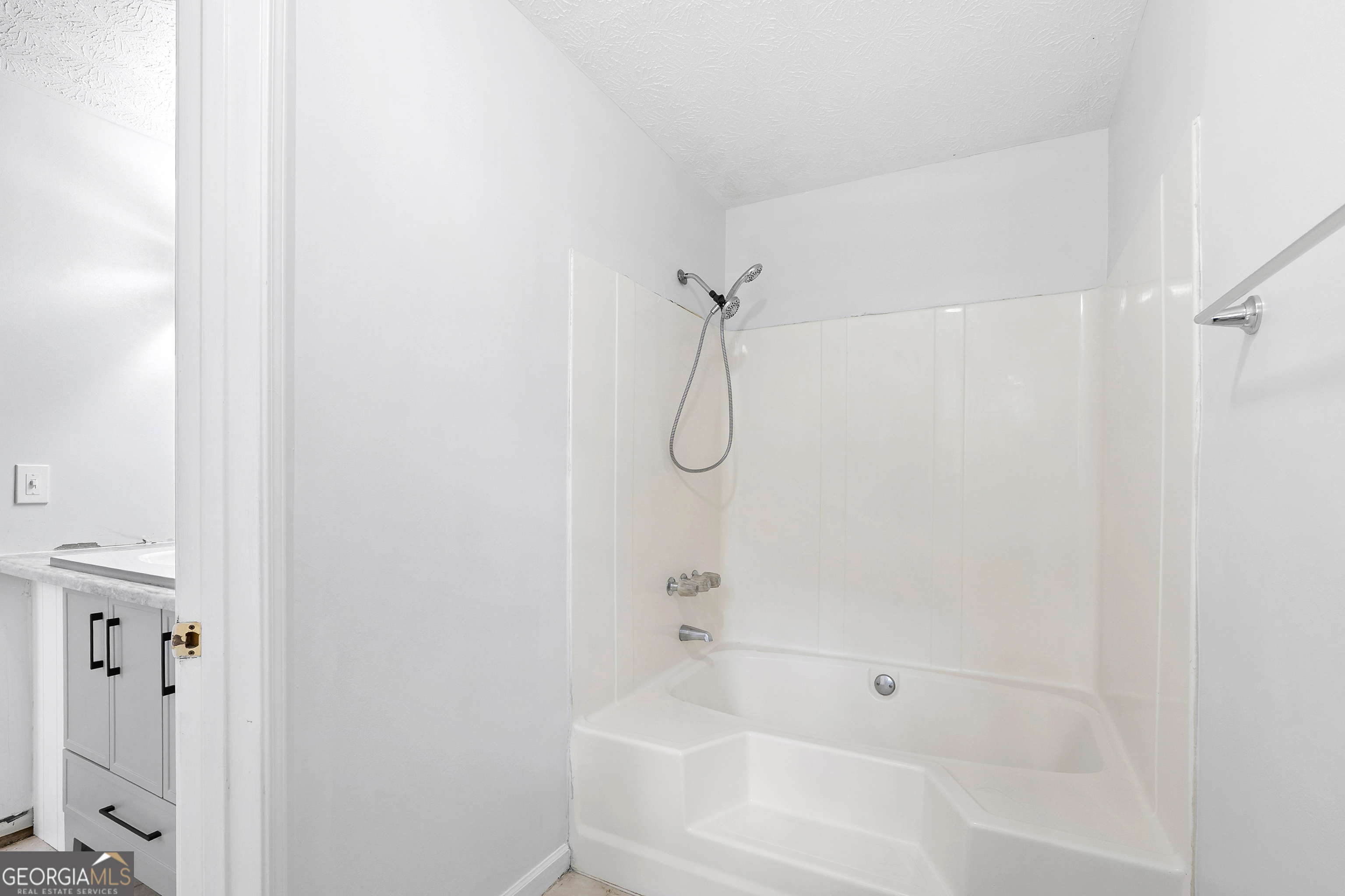 1328 Foxvale Drive Hampton, GA 30228 - Photo 16 of 27 a bathroom with a glass shower door