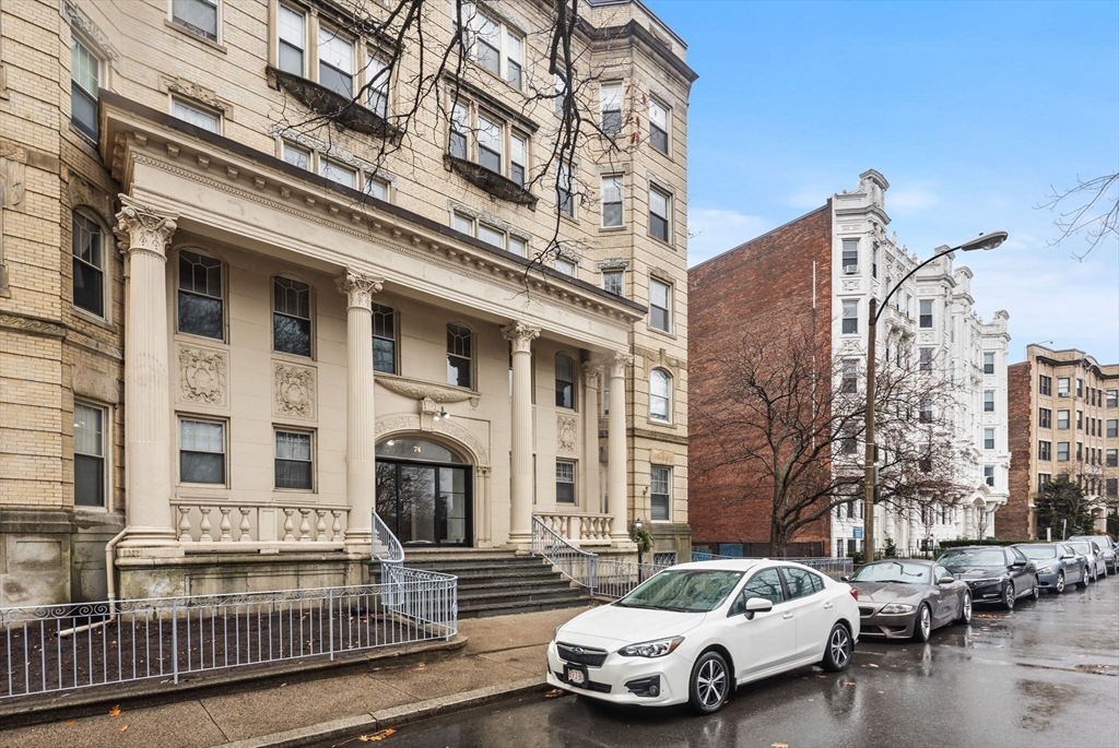 74 Fenway, Unit 45 Boston, MA 02115 - Photo 12 of 12 a car parked in front of a building