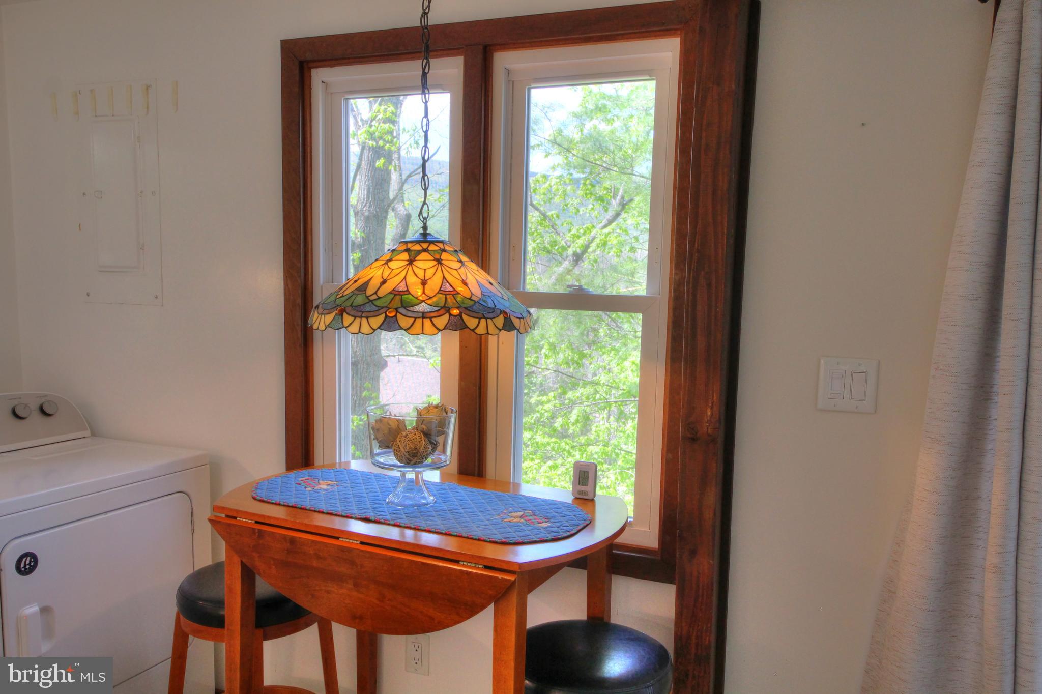 361 The Hill Road, Unit M4 Basye, VA 22810 - Photo 7 of 19 a dining room with furniture and window