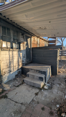 436 Rose Avenue Price, UT 84501 - Photo 36 of 36 Concrete steps leading to a side entry with a metal exterior door