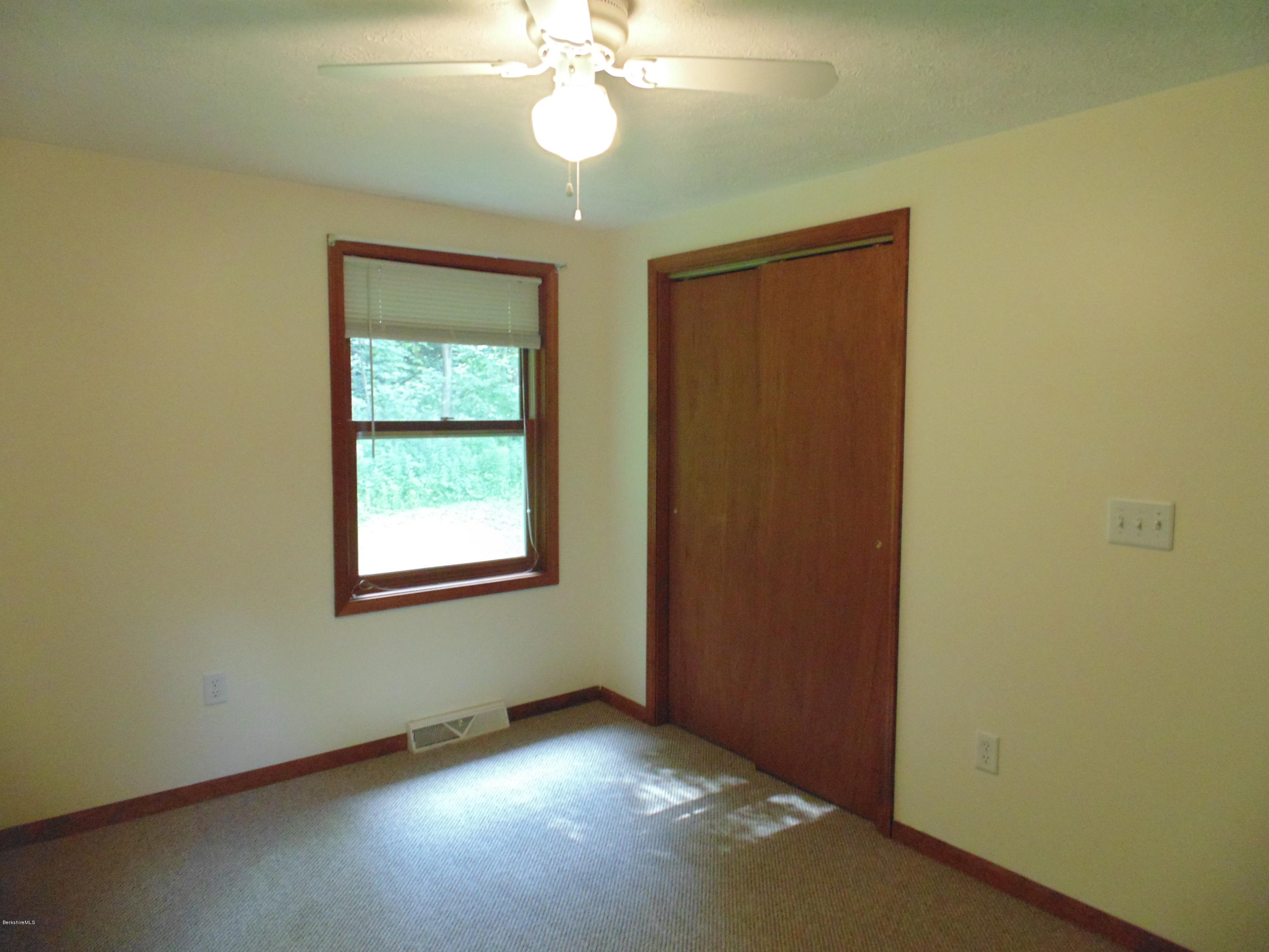 1862 North Main Road Otis, MA 01253 - Photo 14 of 19 an empty room with windows and fan