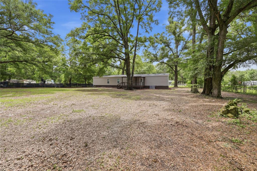 215 Southwest Alpine Place High Springs, FL 32643 - Photo 41 of 41 a view of a yard with an tree
