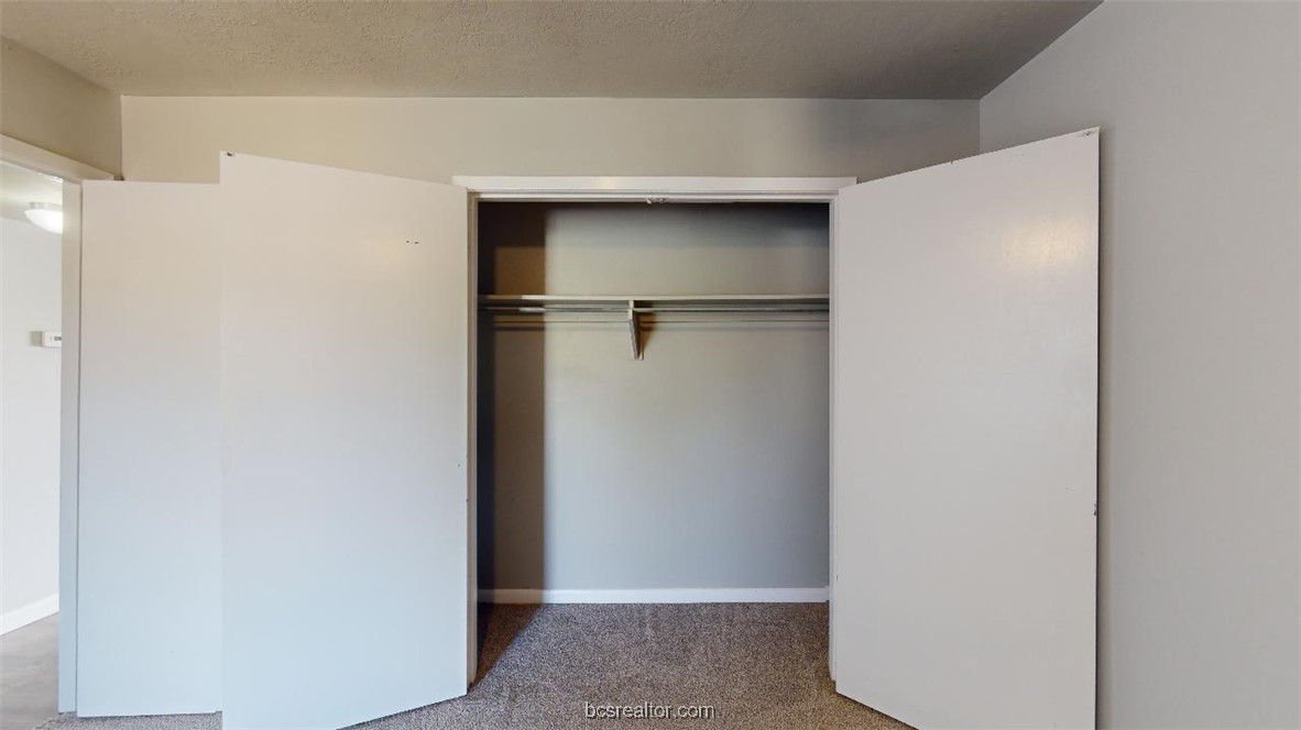 3800 East 29th Street, Unit 11 Bryan, TX 77802 - Photo 10 of 19 a view of walk in closet with empty racks