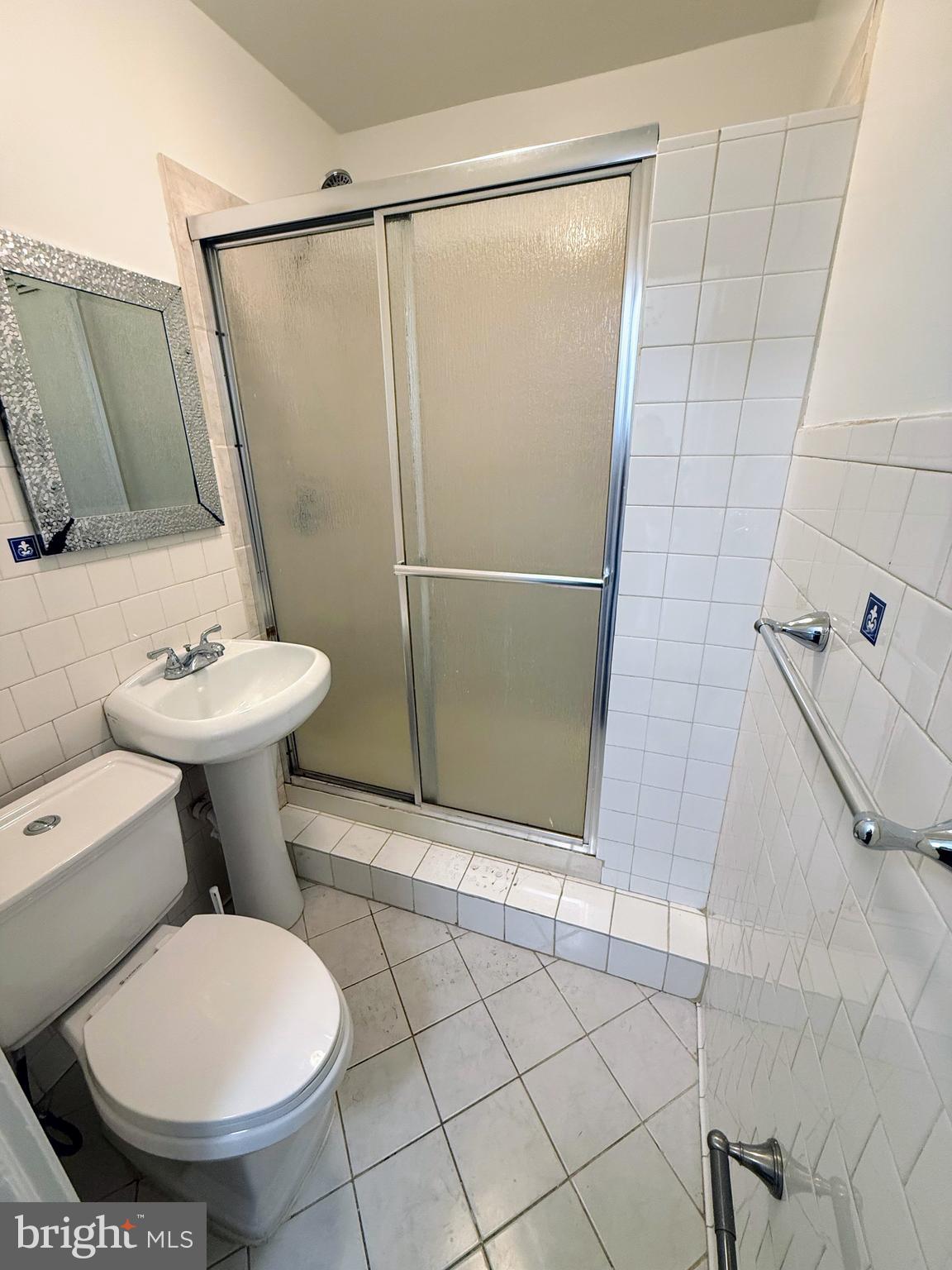 1714 E Street Northeast Washington, DC 20002 - Photo 16 of 30 a bathroom with a sink toilet and shower
