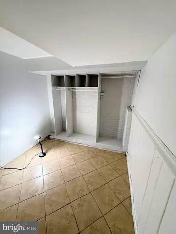 a view of an empty room with windows