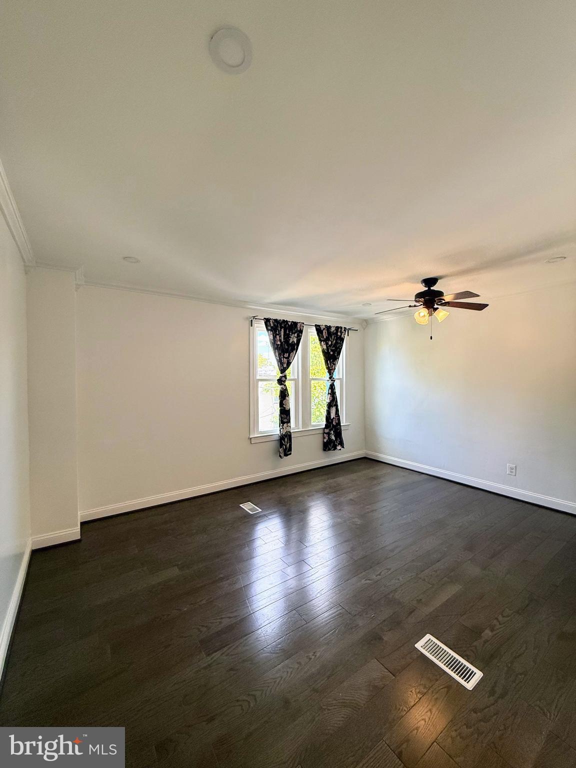1714 E Street Northeast Washington, DC 20002 - Photo 7 of 30 an empty room with wooden floor and windows
