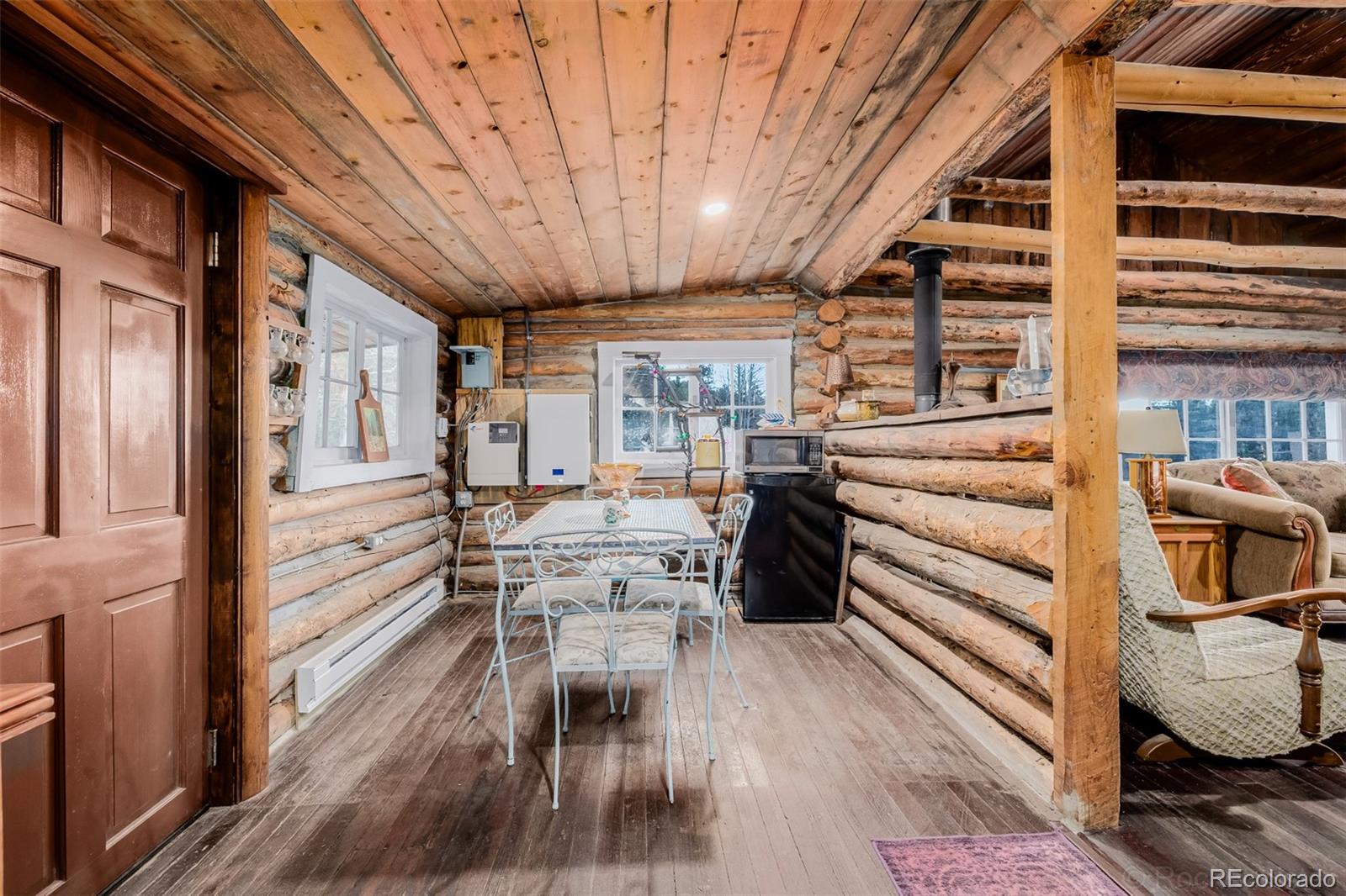 9719 Beaver Pond Conifer, CO 80433 - Photo 16 of 50 a view of a patio with table and chairs