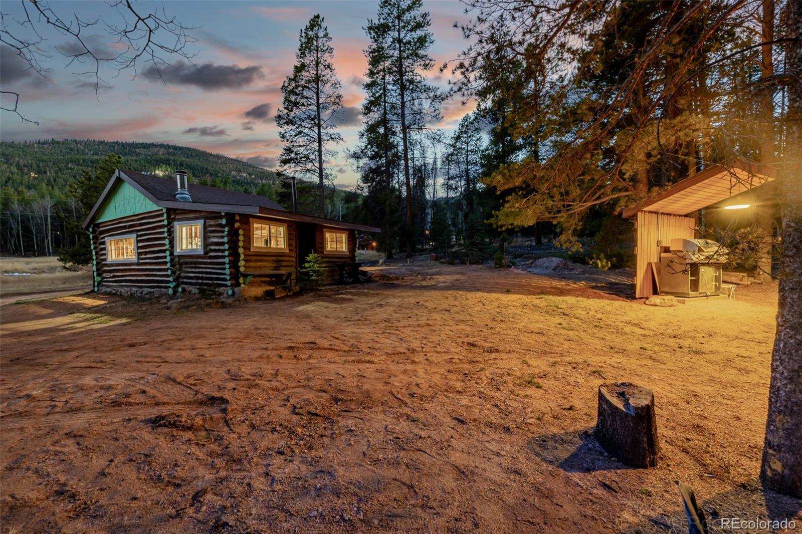 9719 Beaver Pond Conifer, CO 80433 - Photo 27 of 50 a view of a yard with wooden fence