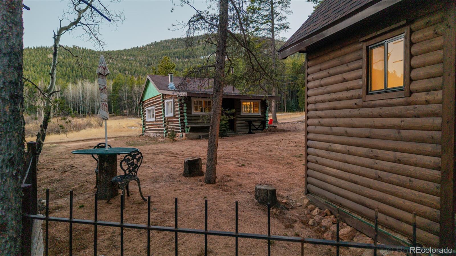 9719 Beaver Pond Conifer, CO 80433 - Photo 45 of 50 a view of a backyard with sitting area