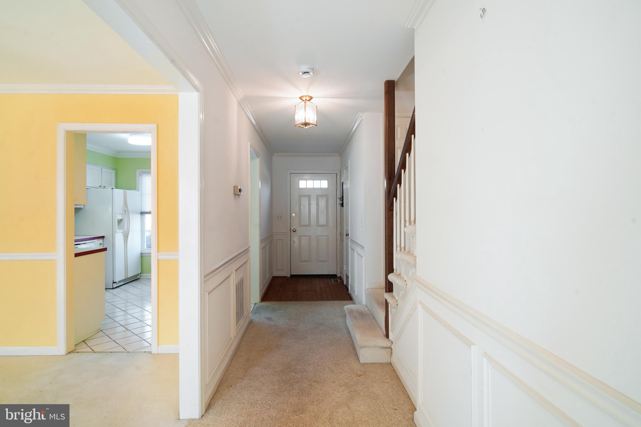 1046 Windrush Lane, Unit 38 Sandy Spring, MD 20860 - Photo 3 of 63 a view of a hallway with wooden floor