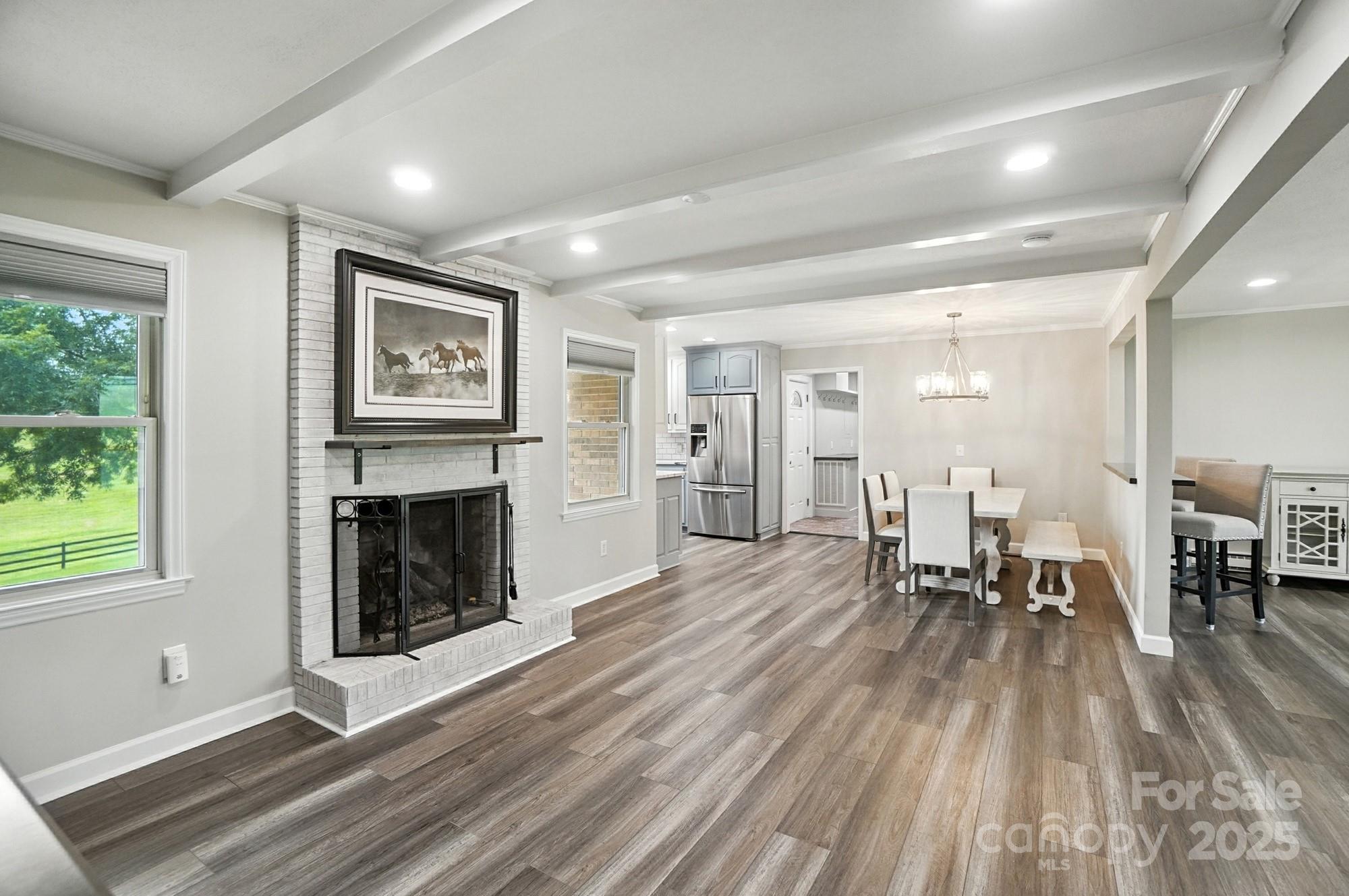 256 Johnson Dairy Road Davidson, NC 28036 - Photo 11 of 44 a living room with furniture and a fireplace