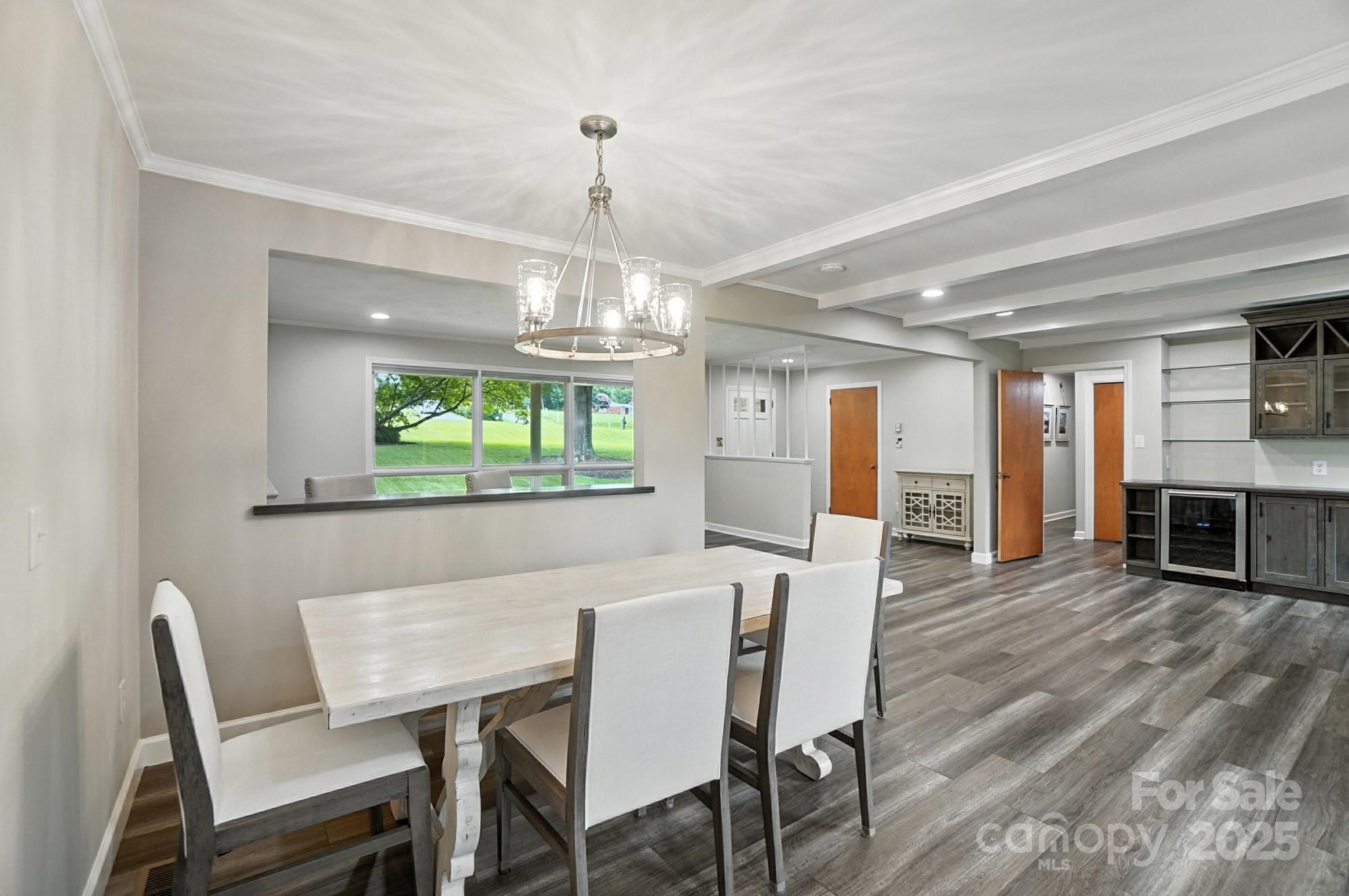 256 Johnson Dairy Road Davidson, NC 28036 - Photo 15 of 44 a view of a dining room with furniture window and wooden floor