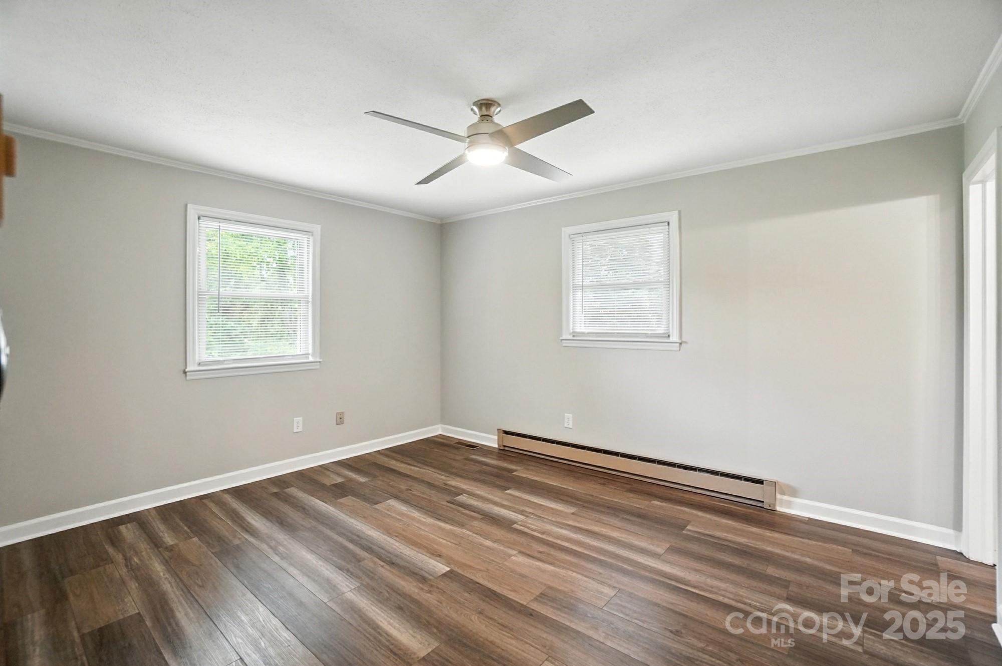 256 Johnson Dairy Road Davidson, NC 28036 - Photo 19 of 44 a view of an empty room with wooden floor and a window