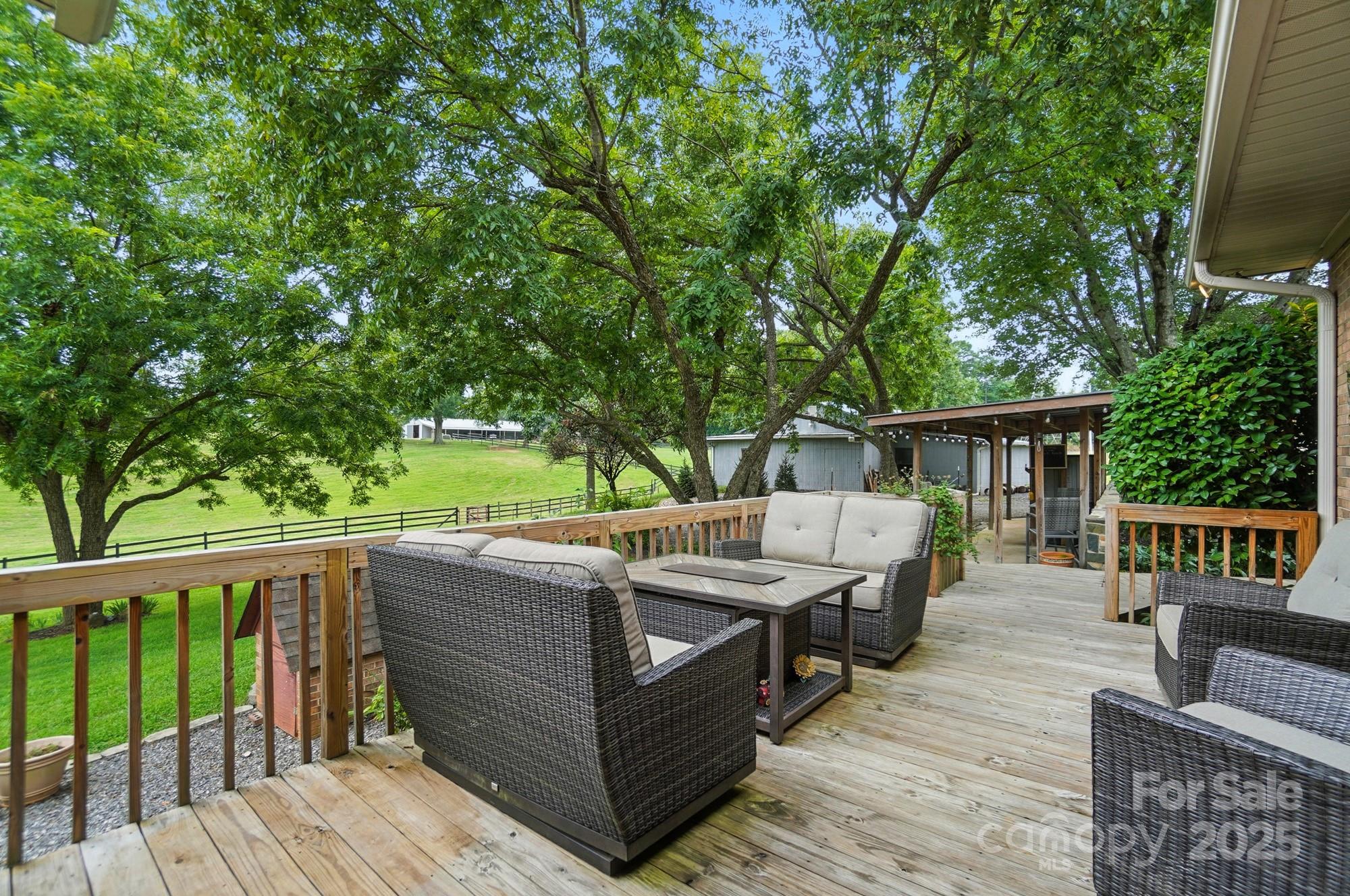 256 Johnson Dairy Road Davidson, NC 28036 - Photo 27 of 44 a view of backyard with deck and outdoor seating