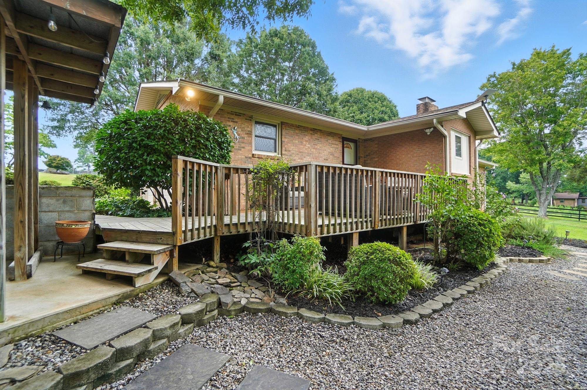 256 Johnson Dairy Road Davidson, NC 28036 - Photo 29 of 44 a view of a garden with a patio