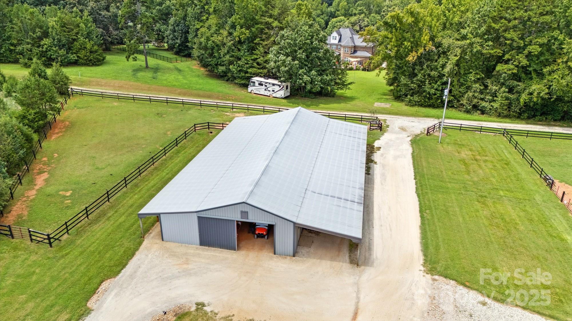 256 Johnson Dairy Road Davidson, NC 28036 - Photo 43 of 44 a view of a swimming pool with a lawn chairs under an umbrella
