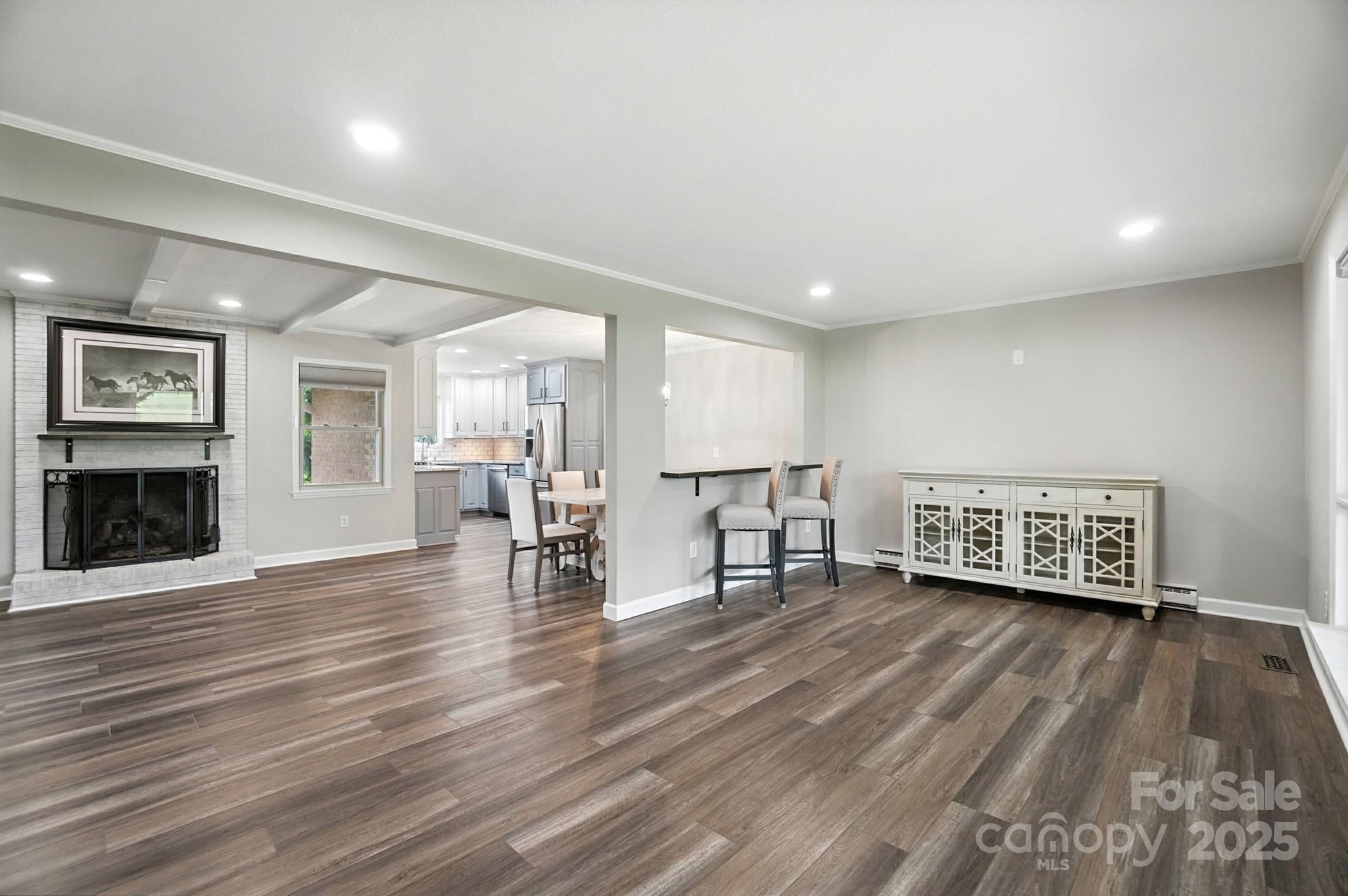 256 Johnson Dairy Road Davidson, NC 28036 - Photo 6 of 44 a living room with furniture and a wooden floor