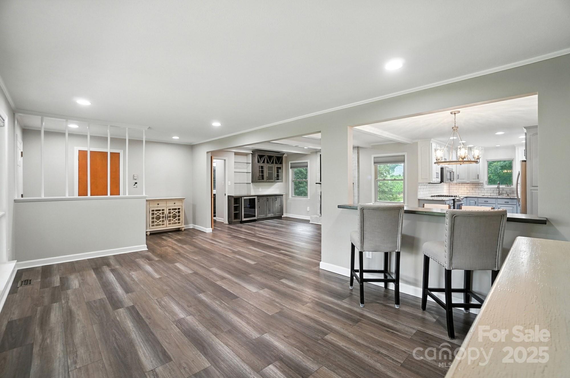 256 Johnson Dairy Road Davidson, NC 28036 - Photo 7 of 44 a view of kitchen with cabinets and wooden floor