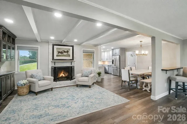 a kitchen with granite countertop a stove sink and cabinets