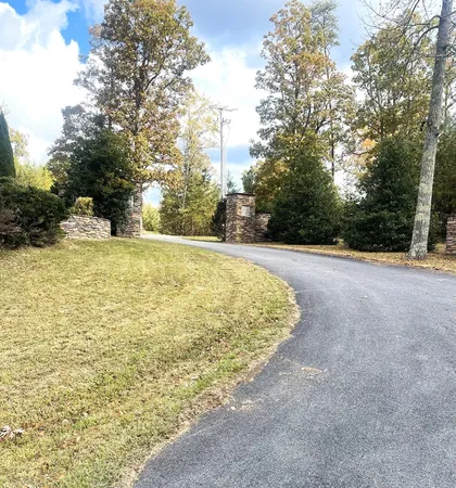 a view of a swimming pool with an outdoor space and seating area