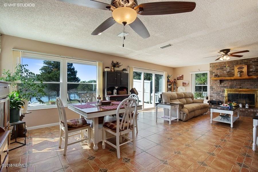 144 Clear Lake Road Crescent City, FL 32112 - Photo 12 of 35 04_144ClearLakeRd_93_LivingRoomDiningRoo