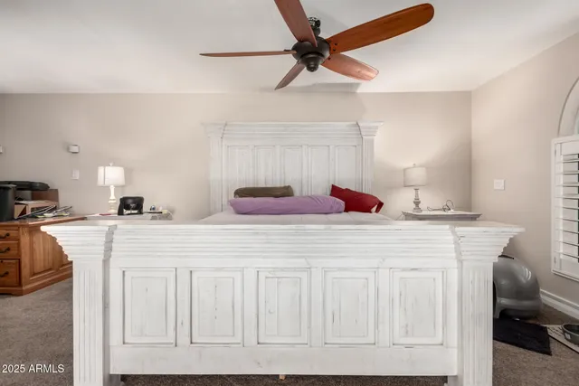 a bed room with a bed and a chandelier