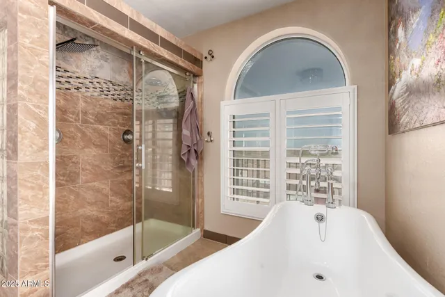 a utility room with stainless steel appliances granite countertop a stove and a refrigerator