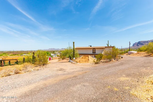 a view of a road with a building in the background