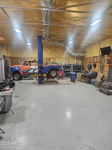 a view of a garage with cars