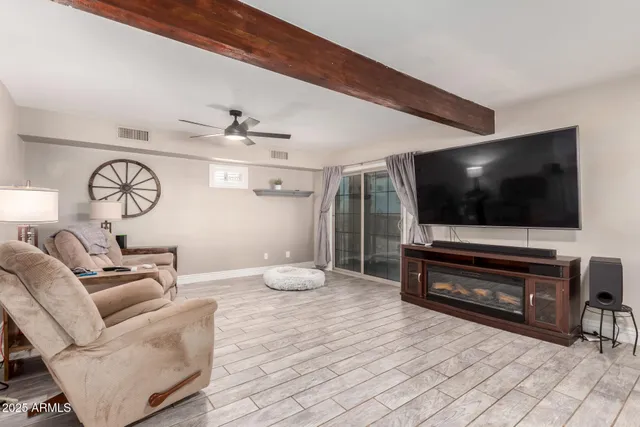 a living room with furniture and a large window