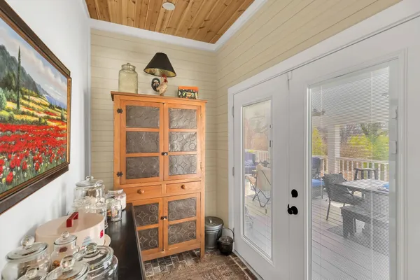a kitchen with a sink cabinets and a window