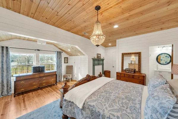 a bed room with a bed and a large window