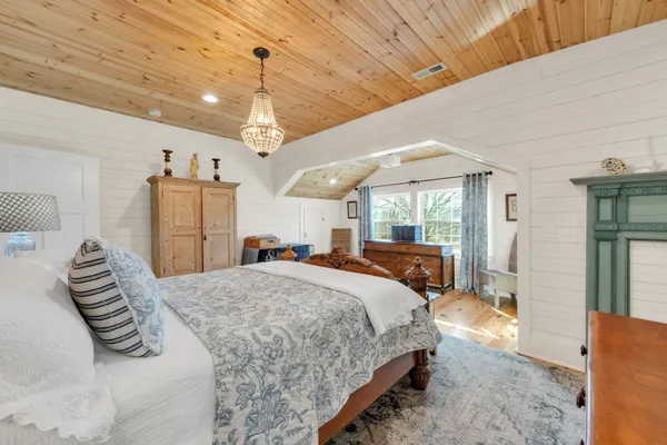 a bathroom with a toilet a sink and a shower curtain