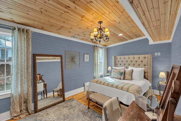 a bed room with a bed furniture and a window