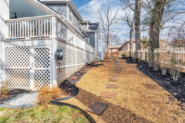 a view of a house with a yard and swimming pool