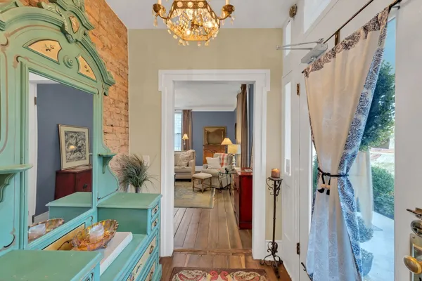 a view of a hallway view with wooden floor and staircase