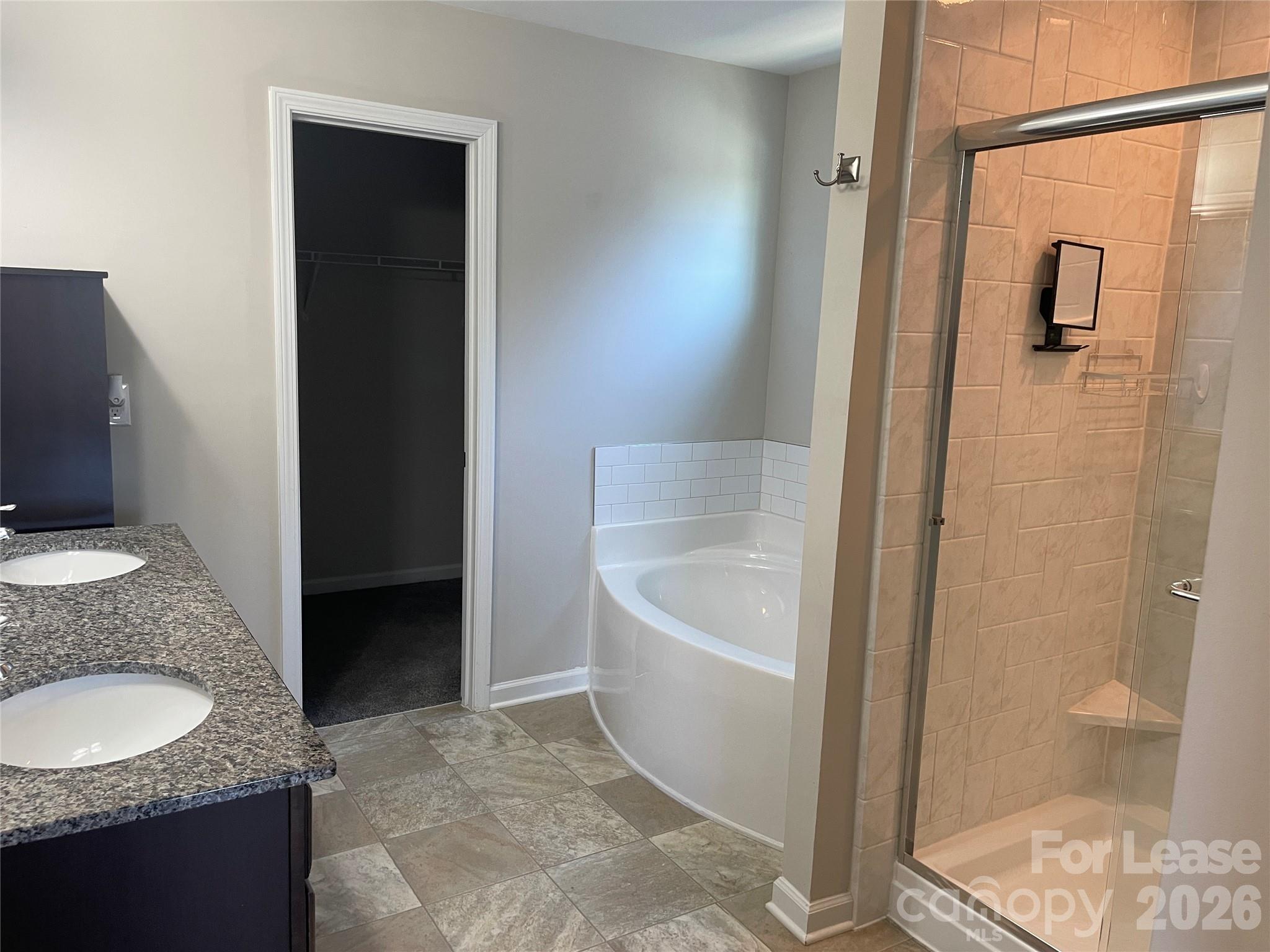 2909 Old Field Road Sumter, SC 29150 - Photo 20 of 39 a bathroom with a granite countertop sink a toilet a mirror and shower