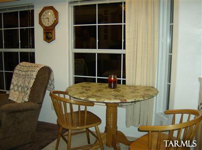 74 Cardinal Corner Benson, AZ 85602 - Photo 10 of 21 a dining room with a table and chairs