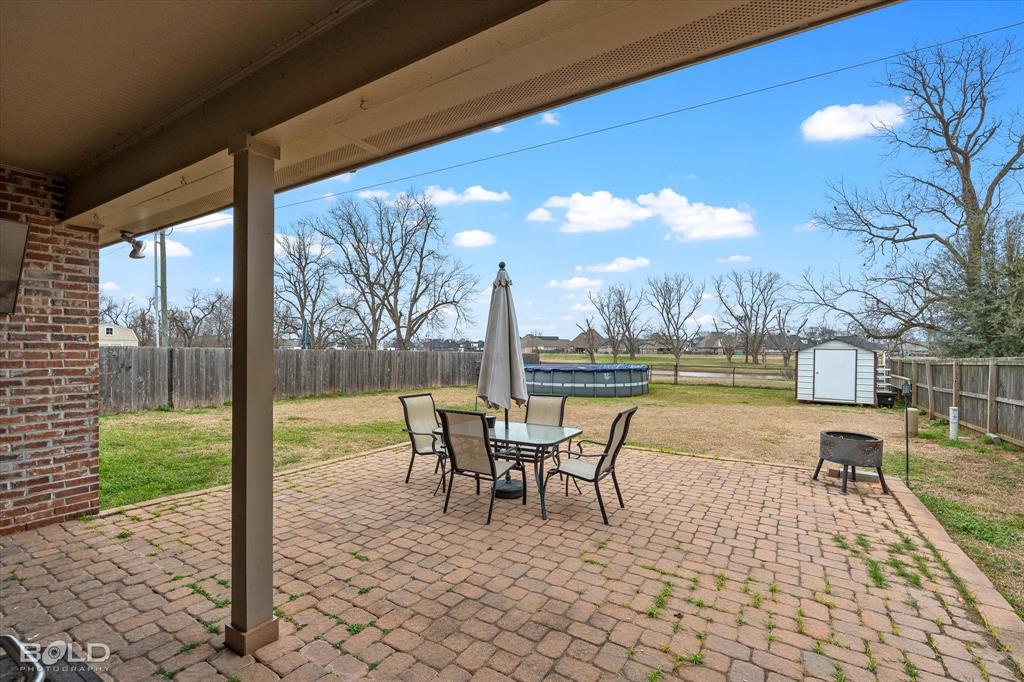 946 Maize Street Bossier City, LA 71111 - Photo 9 of 39 a view of a patio with swimming pool table and chairs