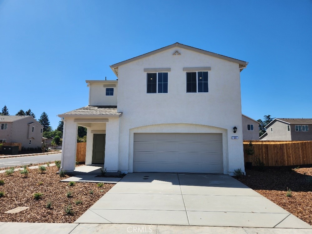 a front view of a house with a garage