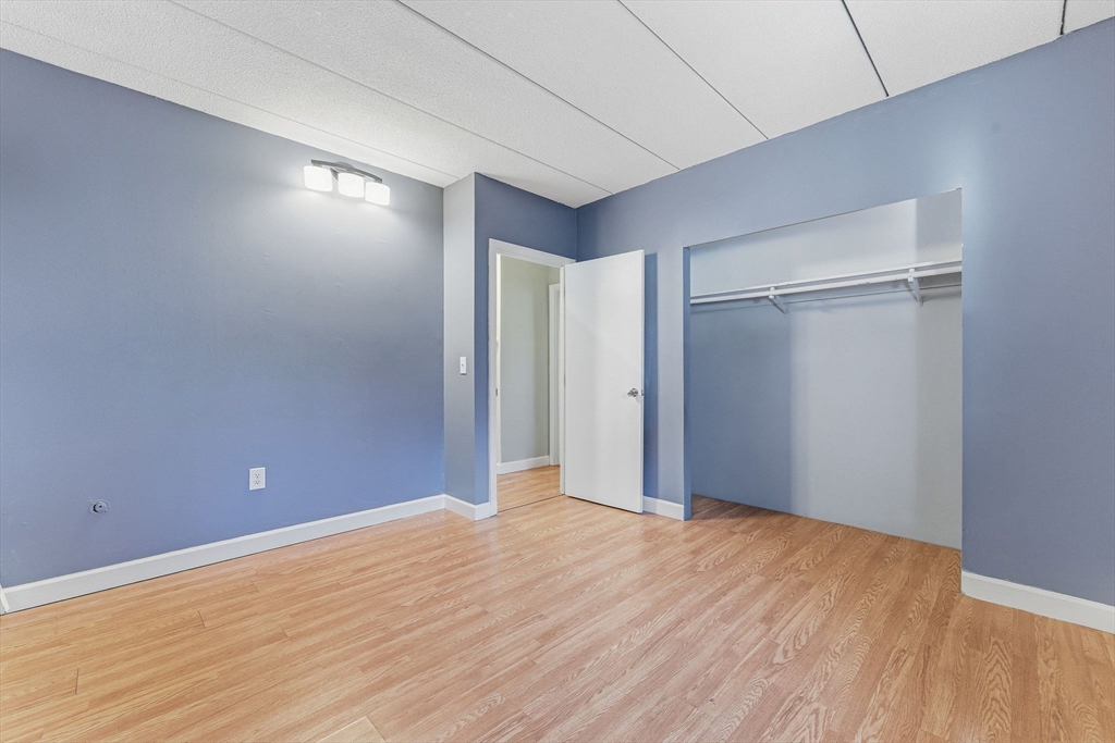 1011 Main Street, Unit 5 Woburn, MA 01801 - Photo 20 of 26 a view of empty room with wooden floor