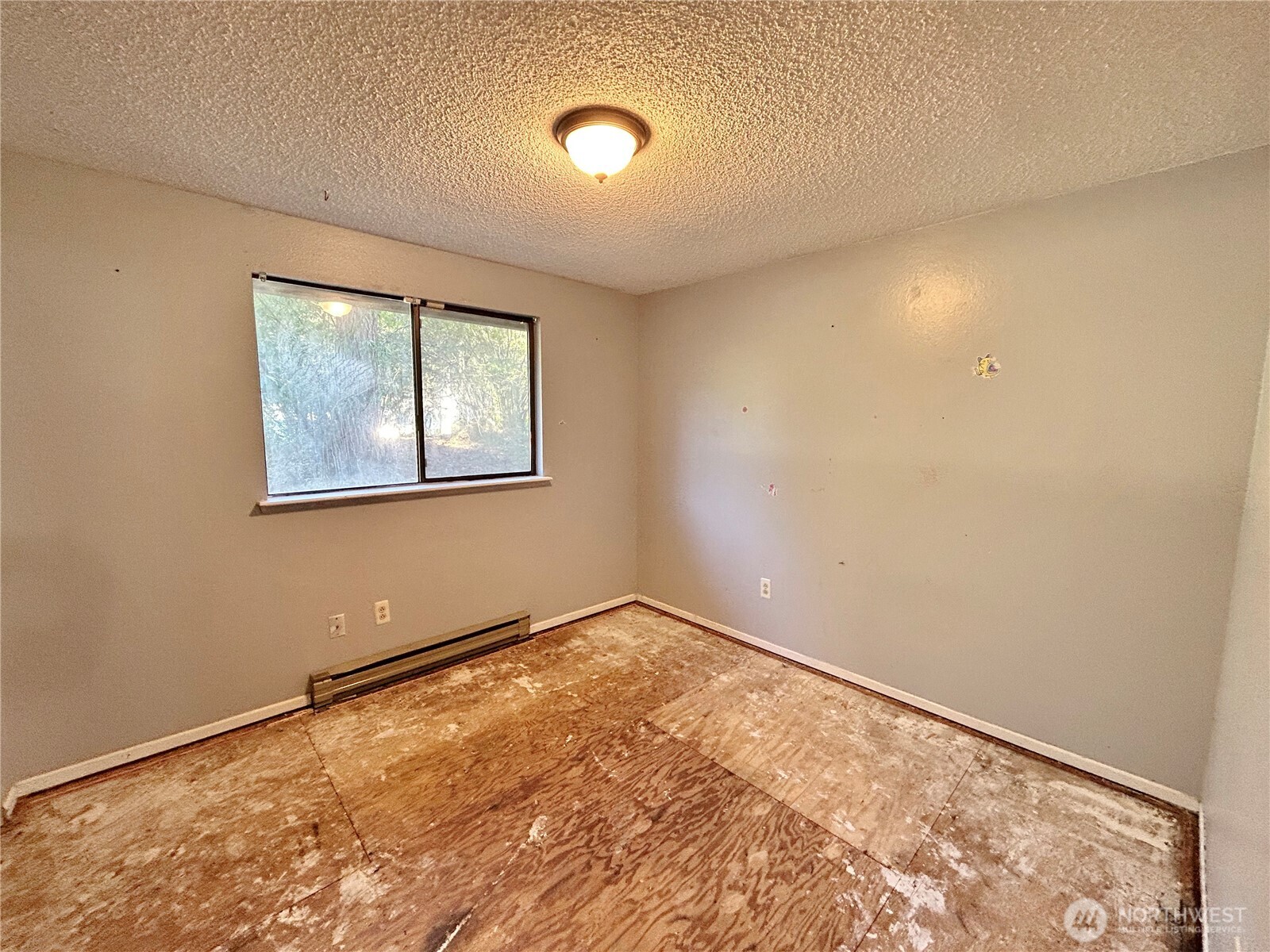 7305 38th Loop Southeast Lacey, WA 98503 - Photo 19 of 32 an empty room with a window