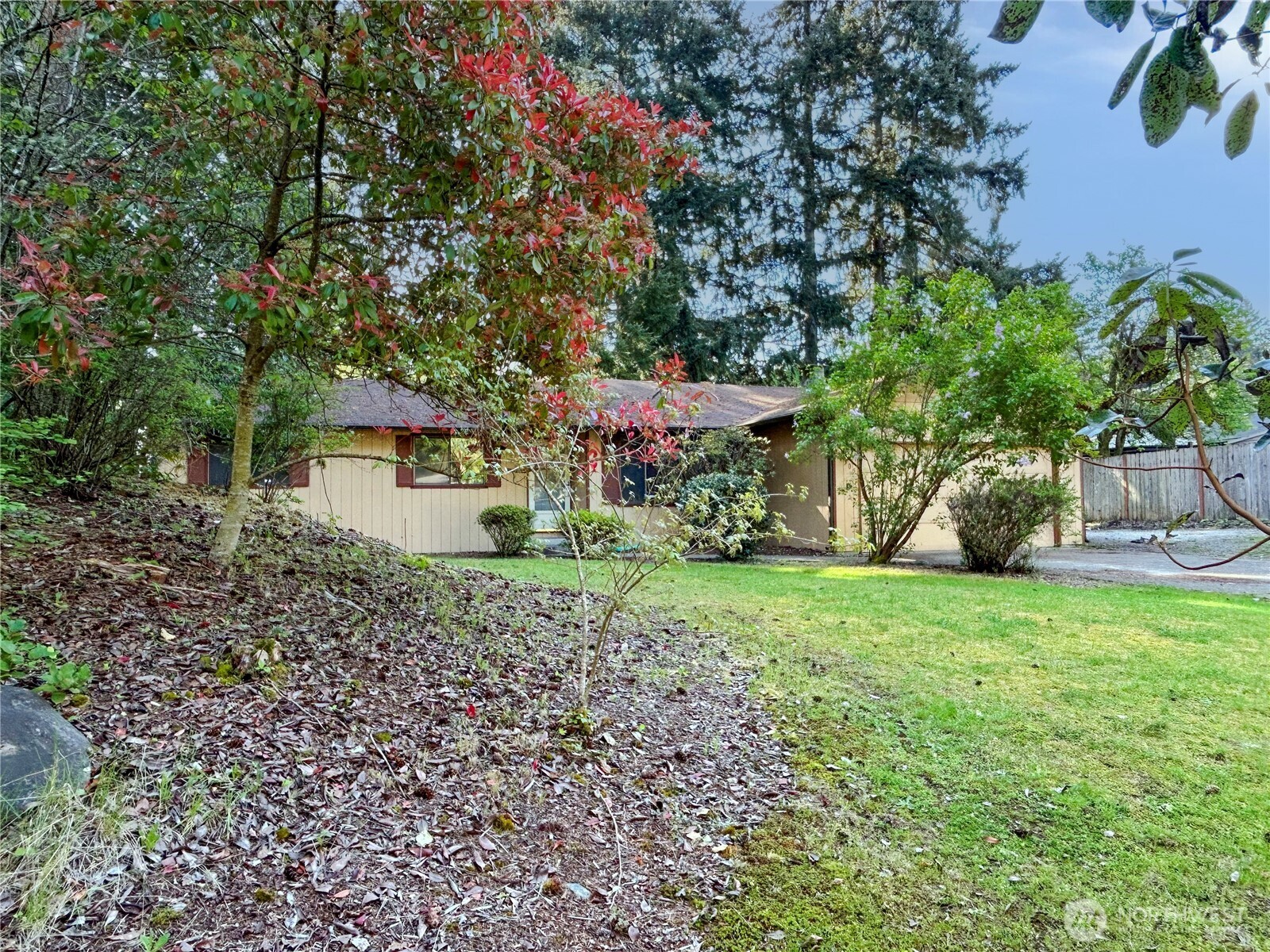 7305 38th Loop Southeast Lacey, WA 98503 - Photo 2 of 32 a view of a house with a yard
