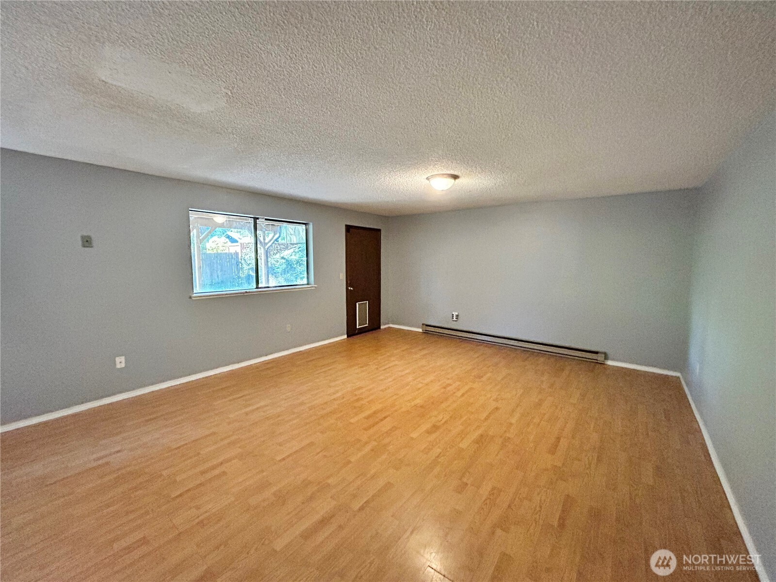 7305 38th Loop Southeast Lacey, WA 98503 - Photo 21 of 32 an empty room with windows