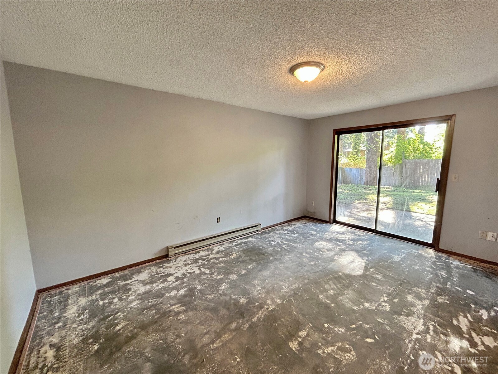7305 38th Loop Southeast Lacey, WA 98503 - Photo 27 of 32 an empty room with large windows