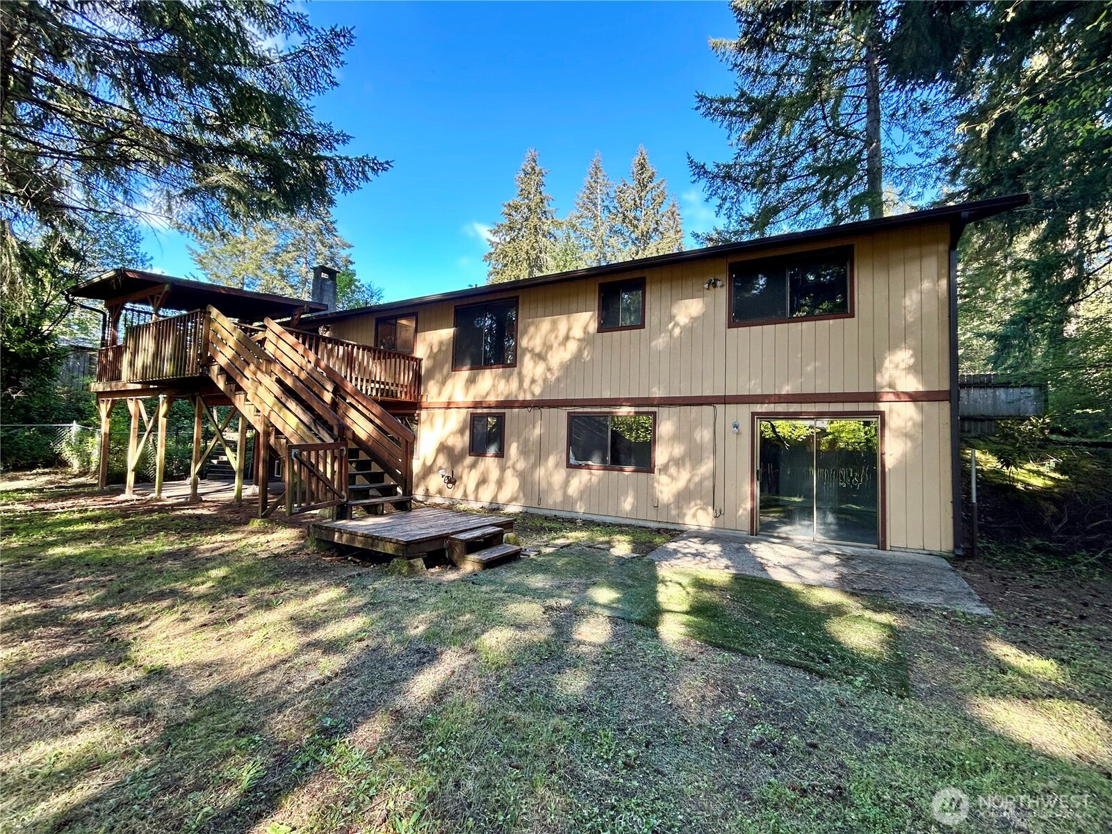 7305 38th Loop Southeast Lacey, WA 98503 - Photo 29 of 32 a front view of a house with garden