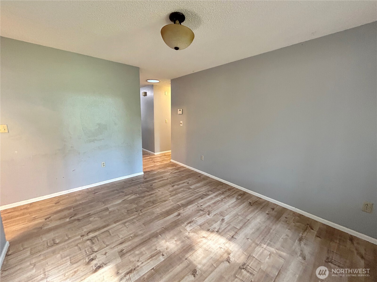 7305 38th Loop Southeast Lacey, WA 98503 - Photo 6 of 32 a view of an empty room