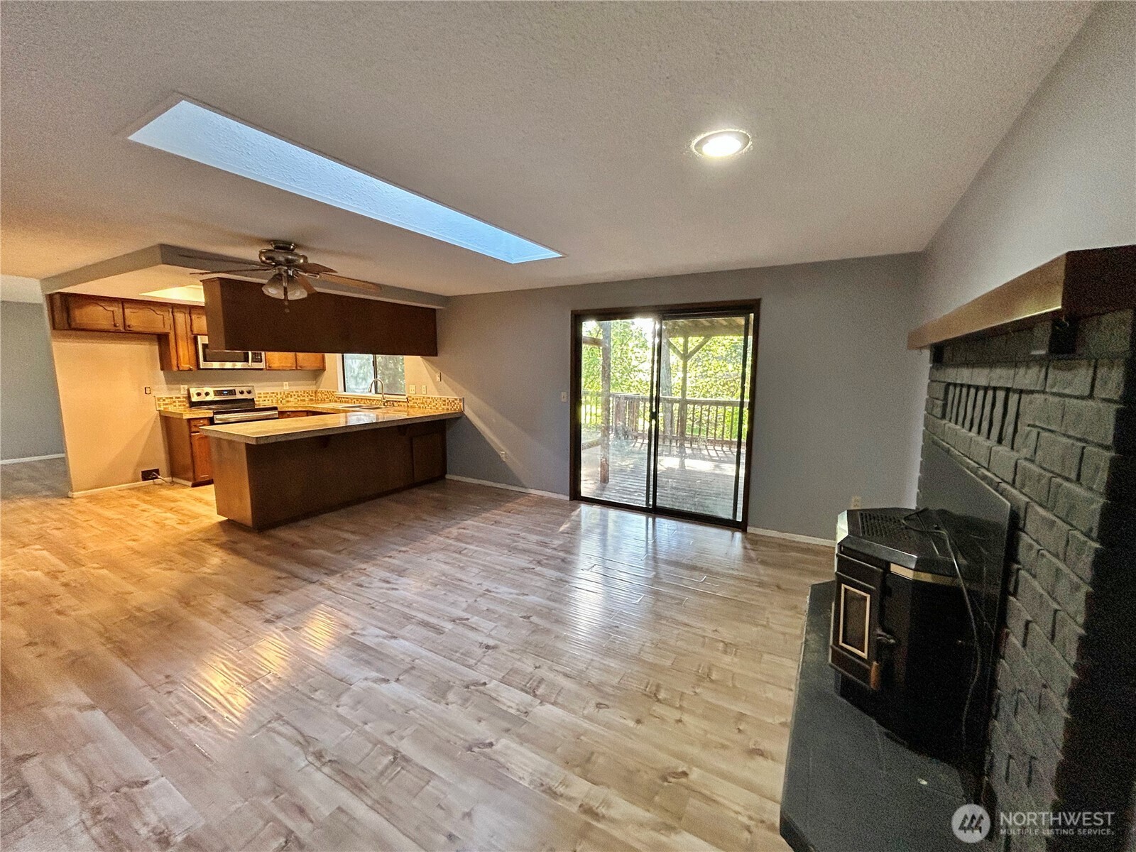 7305 38th Loop Southeast Lacey, WA 98503 - Photo 10 of 32 a view of kitchen and empty room