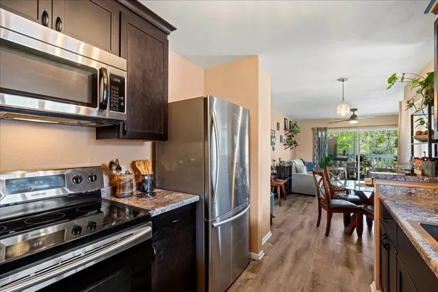 a kitchen that has a sink and a stove